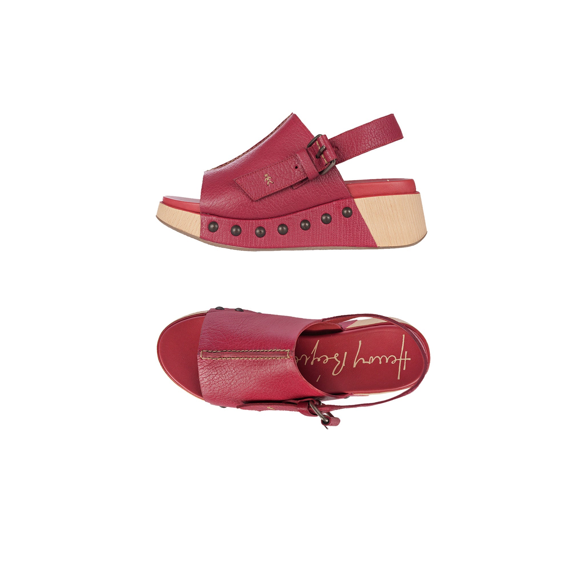 red platform sandals with decorative studs on the sole, an adjustable back strap, and a wooden wedge sole.